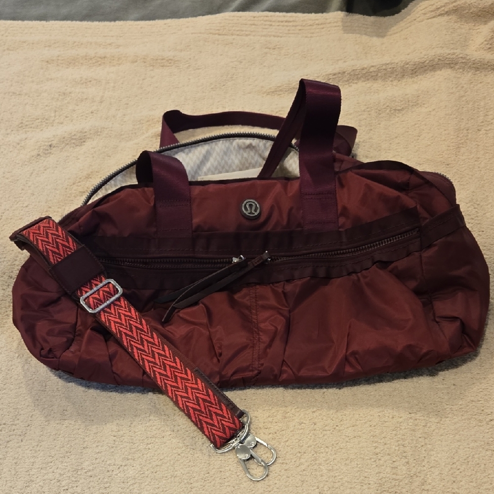 Lululemon Athletica Burgundy Travel Bag with Red Strap
